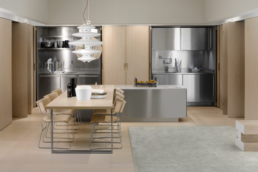 Stainless Steel Modern Kitchen Design With Integrated Dining Table And Creative Lamps 1080x720 